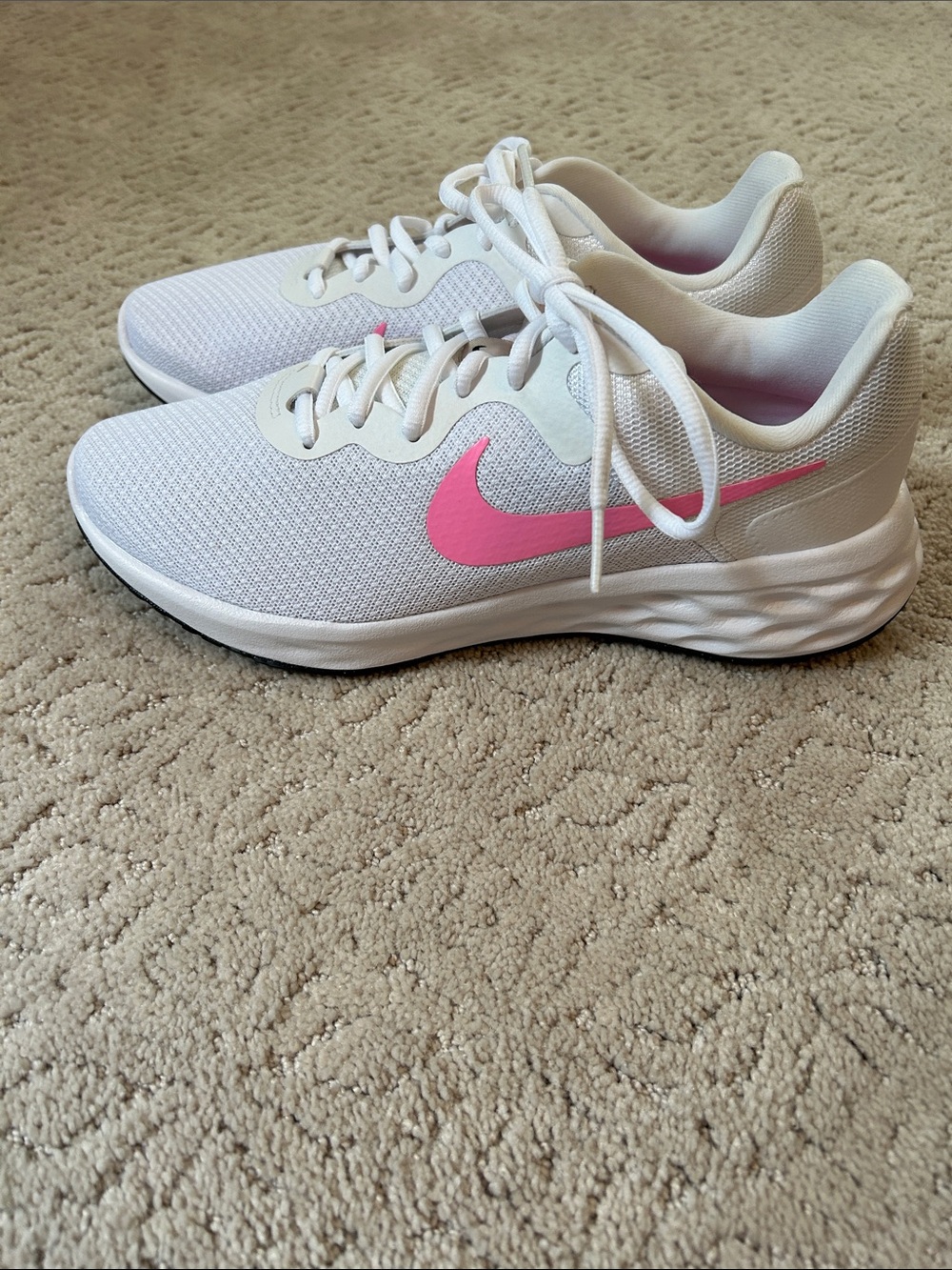 Nike Women's White Athletic Sneakers with Pink Swoosh